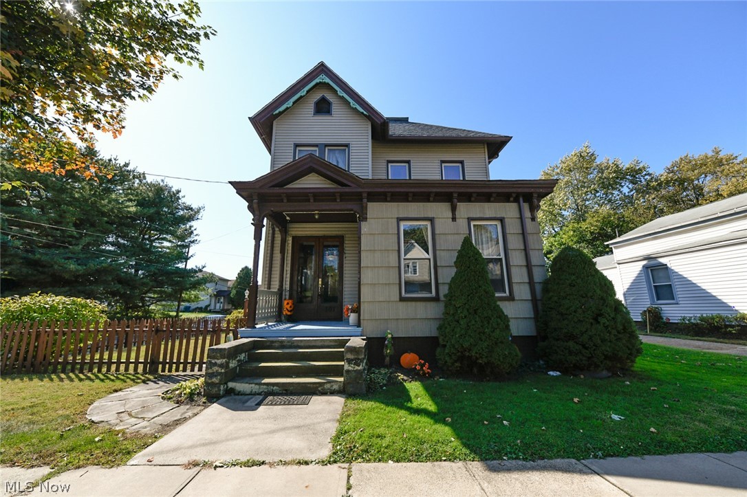 Come check out this massive & charming home with 3 floors, 2 decks & a 2 car garage! Walk in the front door to the large foyer where you immediately notice the 10' ceilings & gorgeous victorian woodwork! The large dining room has hardwood floors, a gorgeous chandelier & is the perfect size for an extra large table. Off the dining room is a bedroom that would make a great space for an office. The kitchen has new flooring, laminate countertops, lots of cabinets for storage & access to the full bathroom. The living room has large windows that offer natural light, ceramic tile surrounding the wood-burning fireplace & newer carpet. Enter the first floor master suite & be pleasantly surprised! There is a large walk in closet, a jacuzzi tub & access to one of the decks! Head up the stunning stairway to the 2nd level & find an entire additional living space! The living room & kitchen are both great in size! Off the kitchen is another full bathroom. There is new laminate flooring through the ha