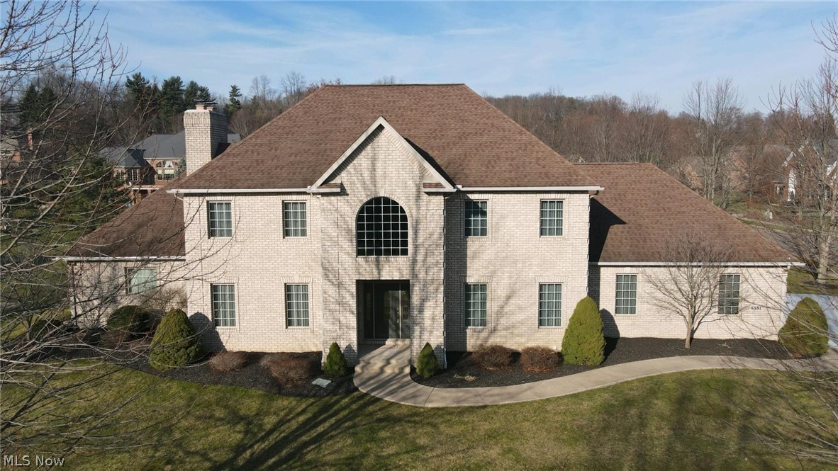 Gorgeous all brick one owner custom home in "The Meadows of Nobles Pond". Inside, you're greeted by an impressive two story foyer with tile flooring and a stunning winding staircase. Relax into the spacious first floor master suite featuring his/her walk-in closets and adjoining luxurious bath with double vanities. The beautiful, spacious office/study off the foyer features ample built-ins and a cozy gas fireplace. The open two story 21 ft great room features a gas fireplace. Prepare your favorite dishes in this gorgeous like-new fully applianced center island kitchen. The second floor features three spacious bedrooms and two more full baths-all like new. The quality well appointed finished basement features a complete living suite-including another full kitchen, bedroom with walk-in closet, a spacious relaxing living area with a third gas fireplace and another full bath. The unfinished area of the basement shows how spacious this great home really is! This home shows like new througho