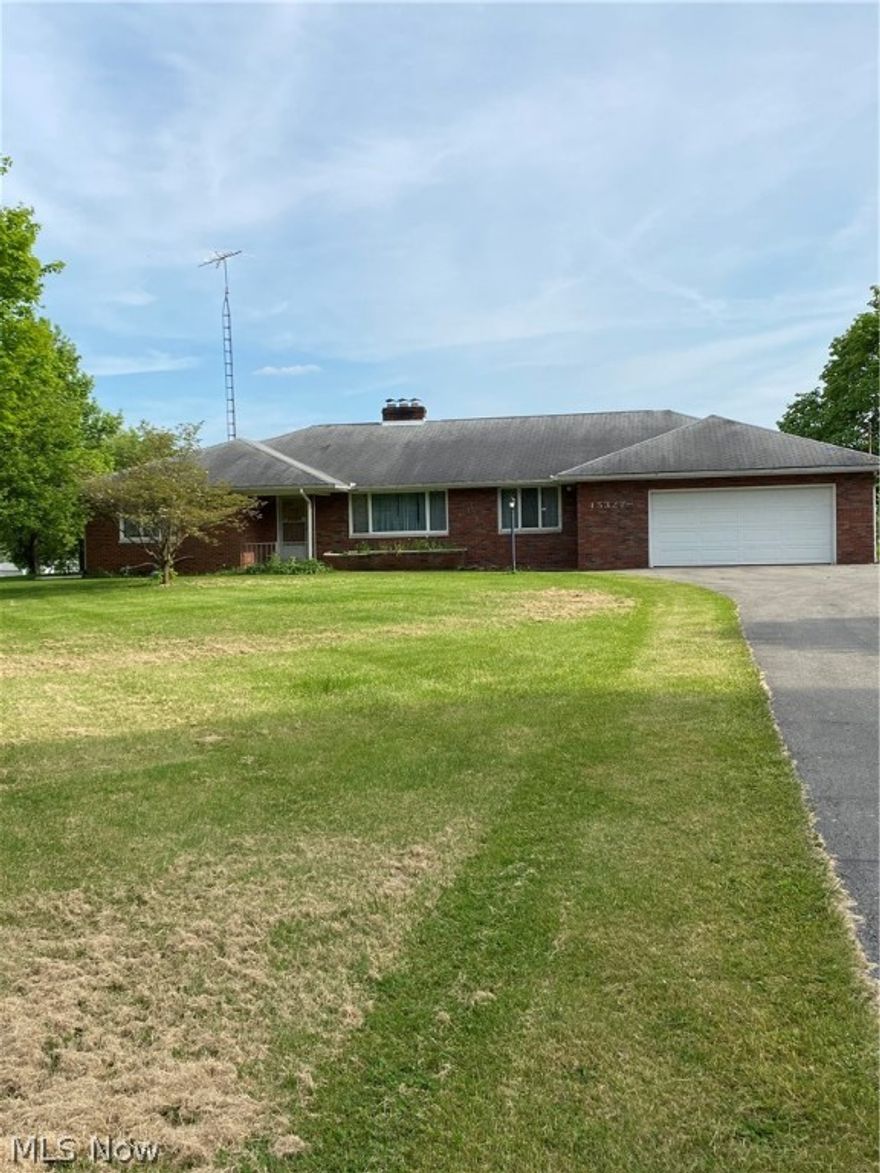 Elkrun Twp.- BRICK, ranch style home offering over 2100 sq, ft. of living space on 1.775 acres. This spacious home offers 2 bedroom, and 2 full baths!  A room currently used as the family room could easily be converted into a 3rd bedroom. The potential 3rd bedroom offers a large closet and as a bonus, an electric log fireplace complete with hearth and mantel! In all closets, including the cedar closet, you will find hardwood flooring! The eat in kitchen has unique walls and countertops and offers ample cabinetry and 2 large pantries! From the kitchen you will find access to the second bath and the attached 2 car garage. There are 2 man doors in the garage; one leads to the front of the house, the other to a room that would make a perfect flower/planting room or mud room. There is a staircase from the garage to the walk up attic, it is a perfect place for all your seasonal storage items. The full basement is where you will find 5 more rooms! One room has the second fireplace, another ro