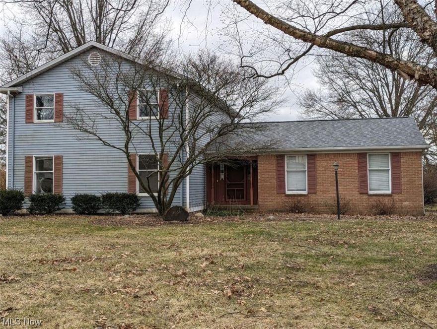 No doubt about it this home is in a great location. 4 bed 2 1/2 bath brick and aluminum 2 story on a large corner lot. City utilities. Deck and patio/basketball court. Shine this home up and it will add value. 3 bedrooms up with master bath and walk in closet. 1st floor bedroom could also be a home office. Family Room with woodburning fireplace with doors to deck and patio. Large side load 2 car garage  and ample parking. Full Basement with laundry and tons of storage