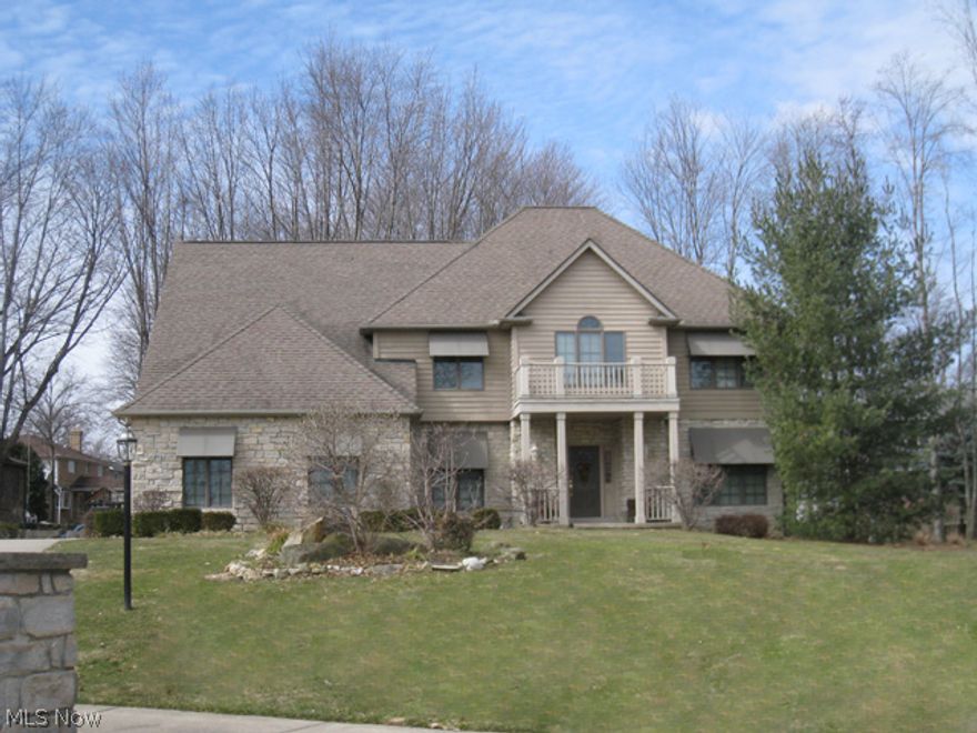 Exceptionally constructed 3 bedroom, 3 bath, stone front colonial situated on a private cul-de-sac setting!  This beautiful home offers a 2-story foyer with a curved staircase, a 1st floor office with French doors &  an entire wall of built-in bookshelves, and a spectacular kitchen with a huge center island, hardwood flooring, a buffet station, and a dramatic bayed dinette area.  Elegant hardwood flooring runs through the foyer, hallways, and kitchen. The 2-story great room is open to the kitchen and offers an impressive floor to ceiling stone fireplace, a deep window with panoramic views of the wooded yard, and a wet bar.  Completing the 1st floor is a formal dining room with a tray ceiling, crown molding and chair railing, a full bath, and a large laundry room with a full wall of cabinets & closet space. The 2nd level includes a spacious master suite with a vaulted ceiling, a sitting room/loft, located off the master, and a glamour master bath with double sinks, skylights, an oversiz