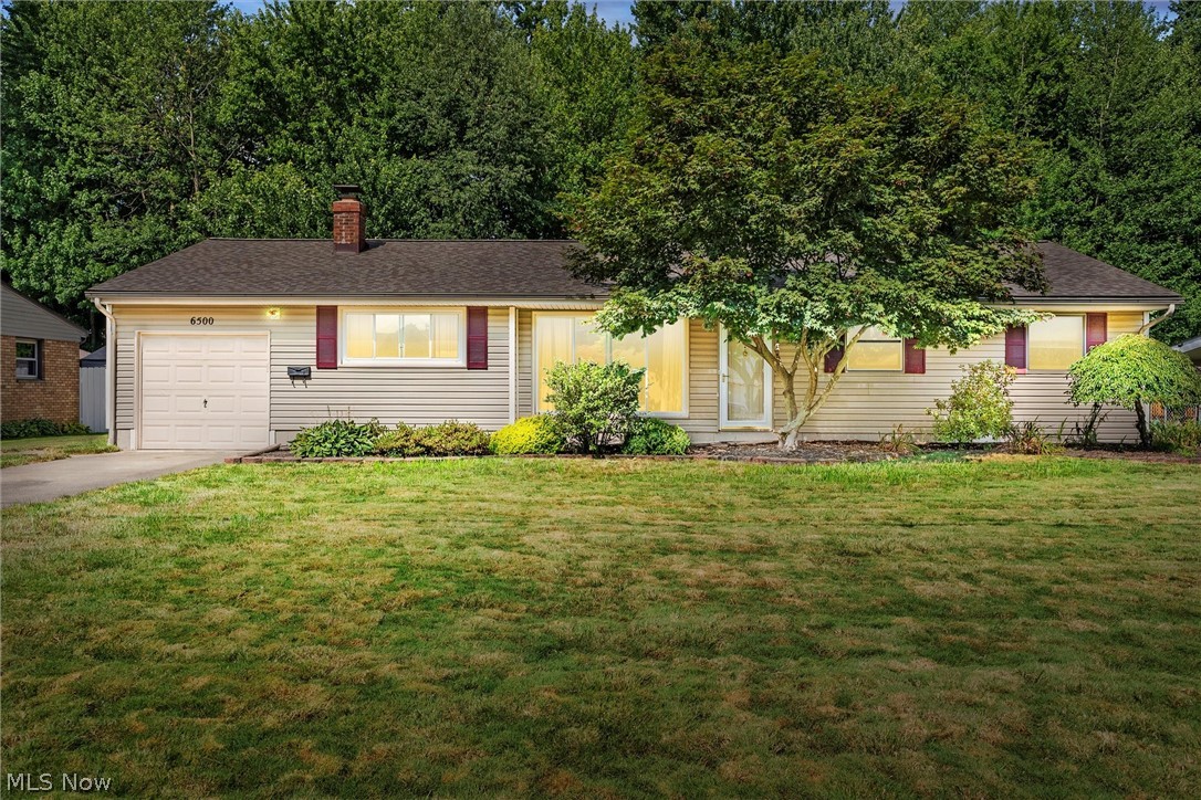 Welcome to this very well-maintained ranch in gorgeous Mentor! Upon entering you will immediately notice a soft palette of paint colors and engineered laminate flooring throughout. The oversized sized living area has built-in book shelving and white brick fireplace. A perfect spot to unwind at the end of the day. The dining area with track lighting flows directly to the kitchen area. With wrap around quartz countertops, white soft close cabinetry, subway tiled backsplash and farmhouse sink. Great for creating fun and exciting recipes.
Three generous sized living rooms and updated full bath complete the main living area. The backyard completely fenced with patio can be great for entertaining guests. More great features include home warranty, attached garage with nature stone flooring, all appliances included, roof 8 yrs young, new hot water tank, kitchen recently updated, new laminate flooring. You need to see for yourself!