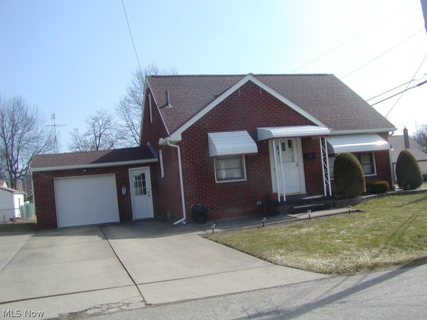 Brick bungalow on corner lot in nice, quiet neighborhood with 3 bedrooms, 1 bath with shower in basement. Some newer windows, new roof 2012. Large rec room with electric fireplace. Glass block windows. Hardwood floors under carpets. Includes appliances. Owner offering 1 year home warranty.