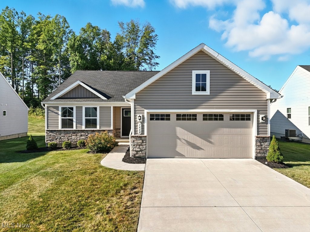 Welcome to this beautifully maintained, 4-years-young ranch home in the desirable Meadow View community of Streetsboro. Conveniently located just off State Route 43 with quick access to the Ohio Turnpike, Route 303, and Kent State University, this low-maintenance single-family home offers a blend of comfort, style, and practicality.
Inside, are 2 spacious bedrooms, including a serene owner’s suite featuring a generous walk-in closet and an ensuite bath complete with an upgraded walk-in shower with built-in bench and ceramic tile surround. A versatile bonus den or office offers the potential for a third bedroom with the addition of a door—ideal for guests or a growing family.
The heart of the home is an open-concept living area filled with natural light, perfect for both everyday living and entertaining. The kitchen delights with white cabinetry, granite countertops, stainless steel appliances, and durable luxury vinyl flooring. A convenient first-floor laundry room with wash basin adds to the home’s thoughtful layout.
The home features abundant storage space throughout, including generous closets, ample kitchen cabinetry, and a full basement with room for shelving or seasonal items.
Downstairs, the large clean and dry basement is a blank canvas ready to be finished—imagine the possibilities for a recreation room, home gym, or media space. Outside, enjoy a private backyard space that backs up to a wooded area, offering both privacy and a front-row seat to local wildlife.
A spacious two-car attached garage completes this lovely home. Whether looking to downsize or enjoy the ease of maintenance-free single-floor living with an HOA that covers snow and trash removal and landscaping, this property is sure to please.
Don’t miss your chance to own in Meadow View—schedule your private tour today!