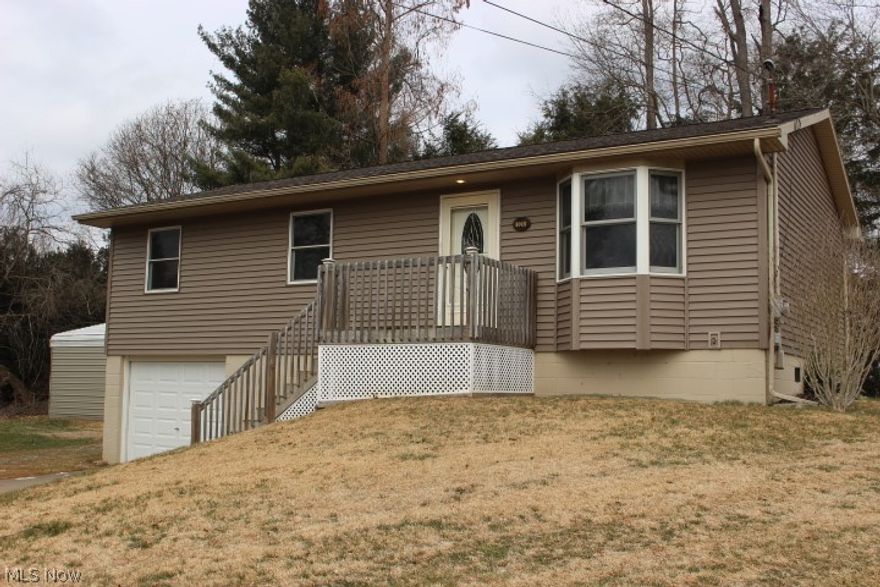 Ranch home Located in Williamstown.  This Home has had many updates including, Vinyl Siding, windows, roof, back deck ,front porch and both bathrooms have been redone.  One bath has a elaborate tiled shower, the lower level bath has a walk in shower and heated tile floors.  There is 3 bedroom upstairs and 1 bedroom and a bonus room that was used for a bedroom in the lower level.  The home is located in a cul-de-sac on a very quiet neighborhood.  There is a Detached garage that is 18 x 26 with a 17 x 26 carport on the side.  The house has a 1 car garage that is used for lawnmowers but could easily be finished into living space or remove 1 wall and you have a full size garage.  There are many possibilities with this home.