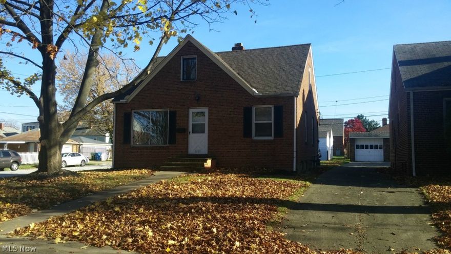 Three bedroom all brick bungalow with spacious updated kitchen, dining room area. Newer carpet and spacious lower level recreation room. All appliances stay including washer and dryer.