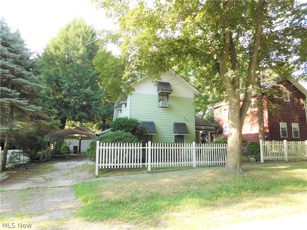 Rustic and charming with lots of potential for the price! Spacious living room and family room area, either could also be used as play room, dining area, whatever you wish! Two bedrooms on the first floor AND a full bathroom! Upstairs is a good sized bedroom and a loft area that could serve as an office or extra living space. Newer furnace 5 years, newer carpeting 9/2019, and low maintenance vinyl siding. Carport and 2 car garage, plus partially fenced large yard make the possibilities endless! Bring your paint brush and decorating ideas because this one will be gone super fast!! *** Please check uploaded documents for radon report. Seller will have radon remediated at acceptable price. Seller is selling AS IS and is not able to do any repairs to the property. No FHA or 203K rehab loans. Sale fell through due to loan requirement changes.