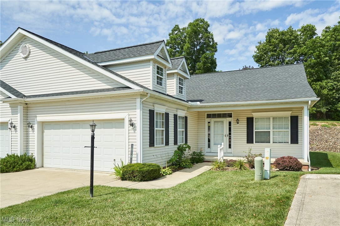 Minutes from 21, 80, 271 & 77, this 2 BR 2 BA Kensington Reserve condo provides convenience and carefree living. Roof replaced '23. A cozy front porch greets you as you enter a large living room with 2 skylights, gas fireplace and upgraded carpet. The kitchen features lots of counter space, wood cabinets and a nice eat-in area with a door leading to the composite deck and private backyard. Convenient 1st floor laundry room is located right off of the kitchen and leads to the attached 2-car garage. Tucked away at the back of the home, the primary bedroom has a nice walk-in closet and en suite bath with single vanity, shower with frameless glass door & linen closet. The 2nd BR (used as a craft room) is located off of the front hall and is right next to the full/guest bath with tub/shower and single vanity. The unfinished lower level features poured concrete walls, tons of storage space and glass block windows. This small but lovely community also features a gazebo for your enjoyment. Don't miss this move-in ready condo close to the new Richfield Brewing Co., Country Maid ice cream & more!