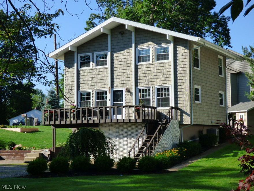 Make Every Day A Vacation.   Spacious cottage with wide open floor plan and vaulted ceilings is perfect for a vacation home or year round living.  A fully- applianced, updated kitchen includes sliders to the side deck, and access to the yard and storage shed.  The Living Room invites you to relax with a wood burning Firplace and vaulted ceilings.  The Large Front Deck is perfect for entertaining and has a peek of the water. Convenient first floor laundry.  Upper level has two bedrooms and a large Loft/Office with built in Kraftmaid cabinetry and access to a small deck.  Rec Room or Man Cave in the Partially finished lower level.  This level also includes a bonus room for a craft or storage space.   Close to Marinas, Golf, Restaurants, Cedar Point, and Route 2. Just minutes to the Boat Basin for music, festivals and fun.