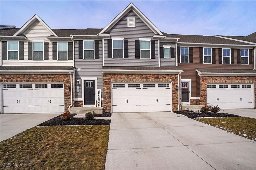 Welcome to this beautifully designed 3-bedroom, 2.5-bath townhouse located in the peaceful and well-connected community of Stow, Ohio. Built in 2022 and offering 1,859 square feet of thoughtfully planned living space, this home combines clean architectural detail, open-concept functionality, and long-term ease — ideal for buyers seeking a quiet, modern, and low-maintenance lifestyle.  Step inside to a light-filled main floor with seamless flow between living, dining, and kitchen areas. Neutral finishes, high ceilings, and uncluttered lines highlight the home’s modern architecture while offering a calming canvas ready for your personal touch. Whether you’re hosting or relaxing, the open layout provides both comfort and quiet elegance.  Upstairs, the home features three generously sized bedrooms, including a spacious primary suite with a private bathroom and walk-in closet — a personal retreat offering both privacy and order. Every square foot is designed to maximize livability, storage, and natural light.  The full, unfinished basement offers even more potential — whether for future expansion, a home office, gym, or dedicated storage space. It’s ready for your vision.
Out back, the home enjoys a quiet, unobstructed rear view with no neighboring structures — offering peaceful surroundings that include a serene view of the cemetery beyond, reinforcing a sense of privacy, space, and stillness.  Other features include modern mechanicals, energy-efficient construction, and HOA-managed exterior care — giving you peace of mind and time back in your schedule.  Conveniently located near parks, trails, local schools, and commuter routes, this home is a perfect blend of structure, serenity, and smart design. If you’re looking for a home that’s built for lasting comfort and practical elegance — this is the one.