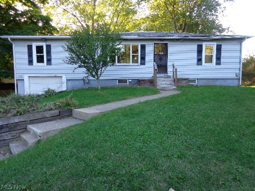 This 3 bedroom, 1 bath home with attached garage could be charming again with some work. Beautiful back yard with deck.  Located close to  shopping and schools yet just far enough away to enjoy the country air.  This house is waiting for you to make it your new home.