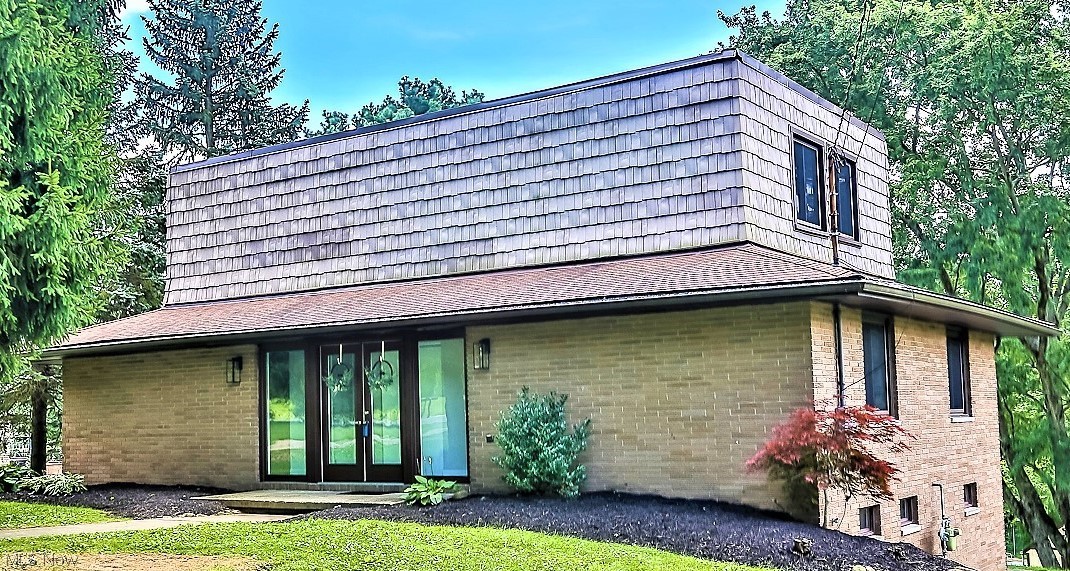 ** Custom Built Contemporary Home Featuring 3 Bdrms, 2 FULL Bathrms, 2000 Sq. Ft. PLUS Walkout Basement, Attached Garage, Concrete Heated INGROUND SWIMMING POOL W/Pool House, DECK, PATIO, Covered Front Porch, Wrap Around Double Entrance/Exit Driveway And .91 ACRES Of Land!! *Concrete Walkway To Entrance From Each Side Of The Drive *Mature Trees In Front For Shade & Trees Behind! *Updates Include: NEW FURNACE, AO Smith Signature Series H20 Tank, Double Glass Entry Doors, Newer Vinyl WINDOWS *KITCHEN Remodel Including White Shaker Style Arcadia CABINETS W/Stainless Pulls, Galaxy Shiny GRANITE Countertops, Custom SHIPLAP Walls, Commercial Style Faucet W/Sprayer & Stainless Sink, LUXURY Plank Flooring, 2 Brushed Nickel Triple Jar Light Fixtures, Newer SS Appliances Including Gas Stove With Middle Griddle Burner! *Main BATHROOM White Barn Door Vanity, SHIPLAP Accent Wall, Brushed Wood Accent Mirrors, Triple Jar Sconce Light, LUXURY Coastal Oak Waterproof Flooring *Master BATHROOM, His & Her White Vanities W/GRANITE Countertop, Luxe Flooring, Dual Mirrors *Updated Electric/Plumbing *Walk In To A Foyer W/Rm For A Sitting Bench *Step Down Into The Living Rm W/Shiny Hardwood Floors, 2 Brick Accent Walls, Recessed Lighting And A Wall Of Eight 6 Ft. Windows! *Step Up To A Dining Area W/Sliders To The Back Deck & New Kitchen Beside It *Two 1st Floor Bdrms & Full Bath *Upstairs MASTER SUITE W/14 Ft. Wide Closet, 2 More Closets, Master Bath W/Walk In Shower AND Sitting Rm *LIVE Video ~