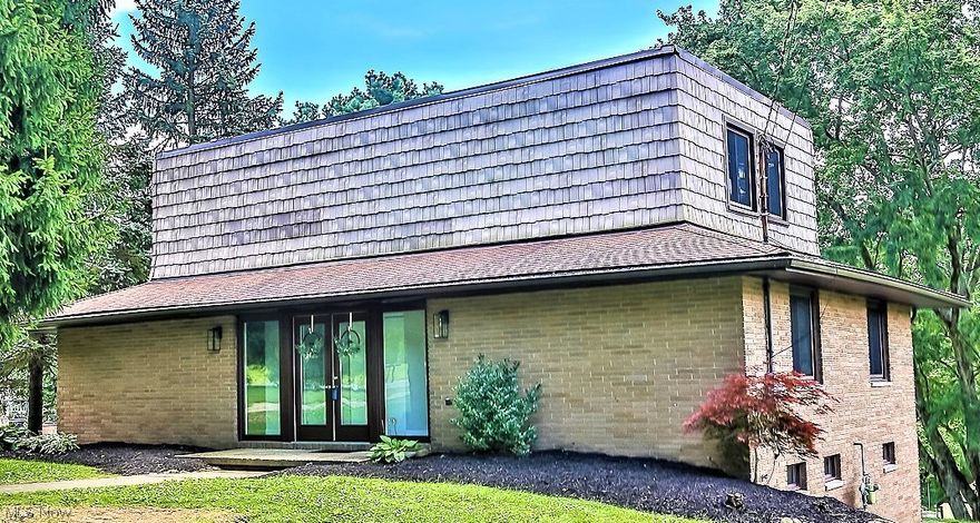 ** Custom Built Contemporary Home Featuring 3 Bdrms, 2 FULL Bathrms, 2000 Sq. Ft. PLUS Walkout Basement, Attached Garage, Concrete Heated INGROUND SWIMMING POOL W/Pool House, DECK, PATIO, Covered Front Porch, Wrap Around Double Entrance/Exit Driveway And .91 ACRES Of Land!! *Concrete Walkway To Entrance From Each Side Of The Drive *Mature Trees In Front For Shade & Trees Behind! *Updates Include: NEW FURNACE, AO Smith Signature Series H20 Tank, Double Glass Entry Doors, Newer Vinyl WINDOWS *KITCHEN Remodel Including White Shaker Style Arcadia CABINETS W/Stainless Pulls, Galaxy Shiny GRANITE Countertops, Custom SHIPLAP Walls, Commercial Style Faucet W/Sprayer & Stainless Sink, LUXURY Plank Flooring, 2 Brushed Nickel Triple Jar Light Fixtures, Newer SS Appliances Including Gas Stove With Middle Griddle Burner! *Main BATHROOM White Barn Door Vanity, SHIPLAP Accent Wall, Brushed Wood Accent Mirrors, Triple Jar Sconce Light, LUXURY Coastal Oak Waterproof Flooring *Master BATHROOM, His & Her White Vanities W/GRANITE Countertop, Luxe Flooring, Dual Mirrors *Updated Electric/Plumbing *Walk In To A Foyer W/Rm For A Sitting Bench *Step Down Into The Living Rm W/Shiny Hardwood Floors, 2 Brick Accent Walls, Recessed Lighting And A Wall Of Eight 6 Ft. Windows! *Step Up To A Dining Area W/Sliders To The Back Deck & New Kitchen Beside It *Two 1st Floor Bdrms & Full Bath *Upstairs MASTER SUITE W/14 Ft. Wide Closet, 2 More Closets, Master Bath W/Walk In Shower AND Sitting Rm *LIVE Video ~