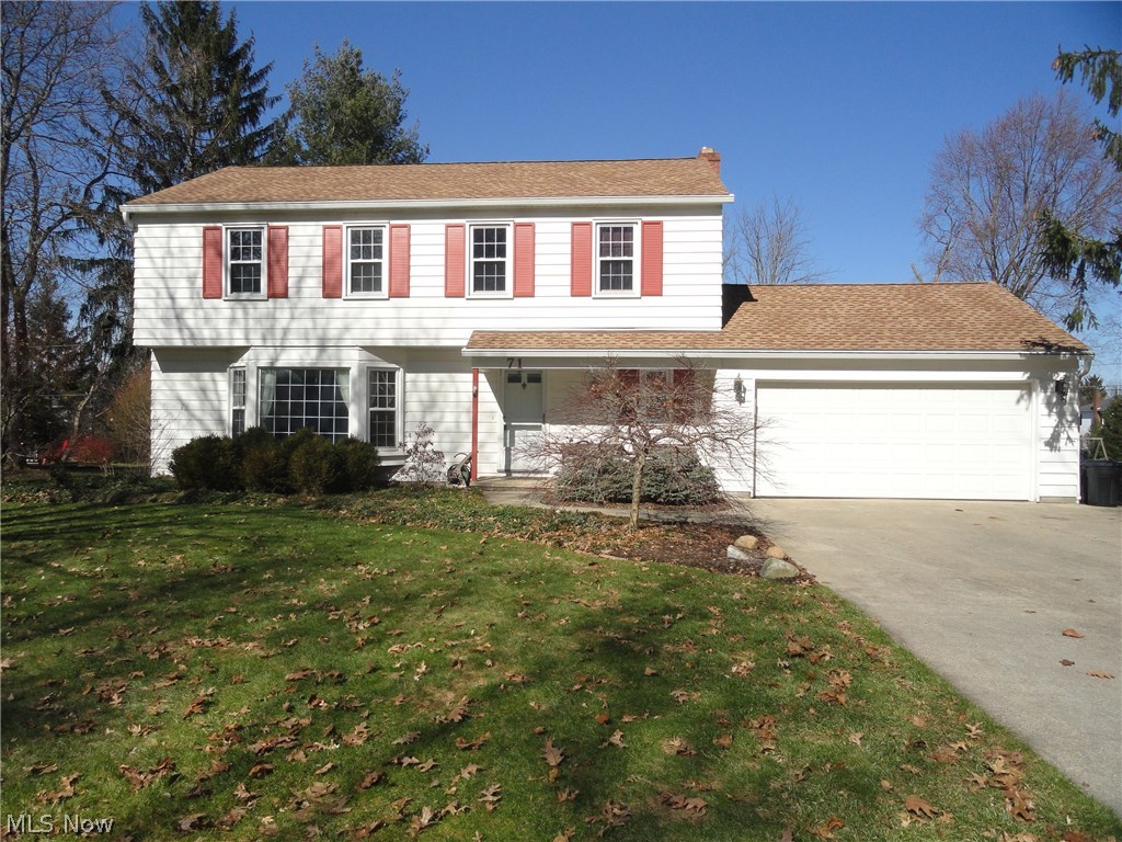Charming Colonial in desirable Hudson neighborhood close to historical downtown Hudson and community parks. Lovingly maintained by the same family for many decades. Formal living room with huge bay window welcoming the sunlight. Beautiful hardwood floors throughout most of the first floor and all 4 bedrooms. Lovely kitchen with updated cabinets and appliances opens to the formal dining room or the cozy family room w/woodburning fireplace and continues to the 15x30 great room addition with cathedral ceiling and generous sized window brightening the living area throughout. Updates include roof, HVAC, windows, bathrooms & kitchen. Patio overlooks spacious flat and grassy yard with plenty of room to run! Seller offering home warranty too. Call today for your private showing.