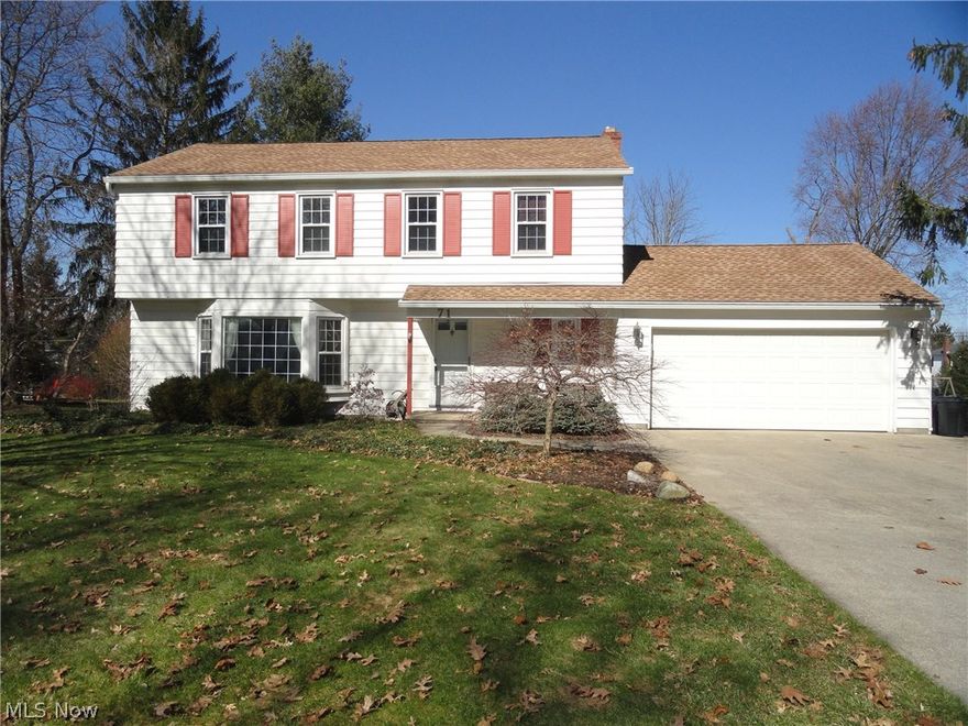 Charming Colonial in desirable Hudson neighborhood close to historical downtown Hudson and community parks. Lovingly maintained by the same family for many decades. Formal living room with huge bay window welcoming the sunlight. Beautiful hardwood floors throughout most of the first floor and all 4 bedrooms. Lovely kitchen with updated cabinets and appliances opens to the formal dining room or the cozy family room w/woodburning fireplace and continues to  the 15x30 great room addition with cathedral ceiling and generous sized window brightening the  living area throughout. Updates include roof, HVAC, windows, bathrooms & kitchen. Patio overlooks spacious flat and grassy yard with plenty of  room to run! Seller offering home warranty too. Call today for your private showing.