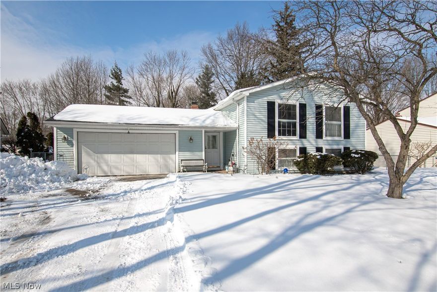 Welcome home to this spacious, unique bi-level with 5 bedrooms! Enter through the foyer, which lets in tons of light and connects to the large deck off the rear of the house, where you can sit and enjoy the serene fenced yard. On the main/upper level of this home you'll find a huge living room/dining room, just off the kitchen. Then down the hall, two large bedrooms and full bath. The lower level provides even more entertaining and relaxing space with a family room featuring a woodburning fireplace and Nature Stone floor and sliders out to a covered patio. Nearby, the 5th bedroom (which could also serve as an office/craft room/playroom, etc) has sliders to the patio as well. Two other bedrooms and full bath round out the lower level. Roof (including gutters and flashing) was replaced in 2017, and the gutters have leaf guards! This home is conveniently located very close to a new playground, and is just a short drive from charming downtown Olmsted Falls.