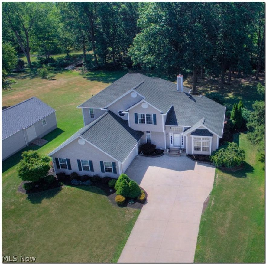 Beautiful custom built home. Check out the pictures! 4 bedrooms, 3-1/2 baths with finished walk-out basement. Walkout leads to lighted stamped concrete patio surrounded by paver walls. So many unique qualities make it a must see! Northern Canadian maple flooring throughout. Open concept layout. Tall ceilings. 1.84 acres. This is a "Carpenter's house" = many extra construction features. Square footage DOES NOT include finished walk-out basement.