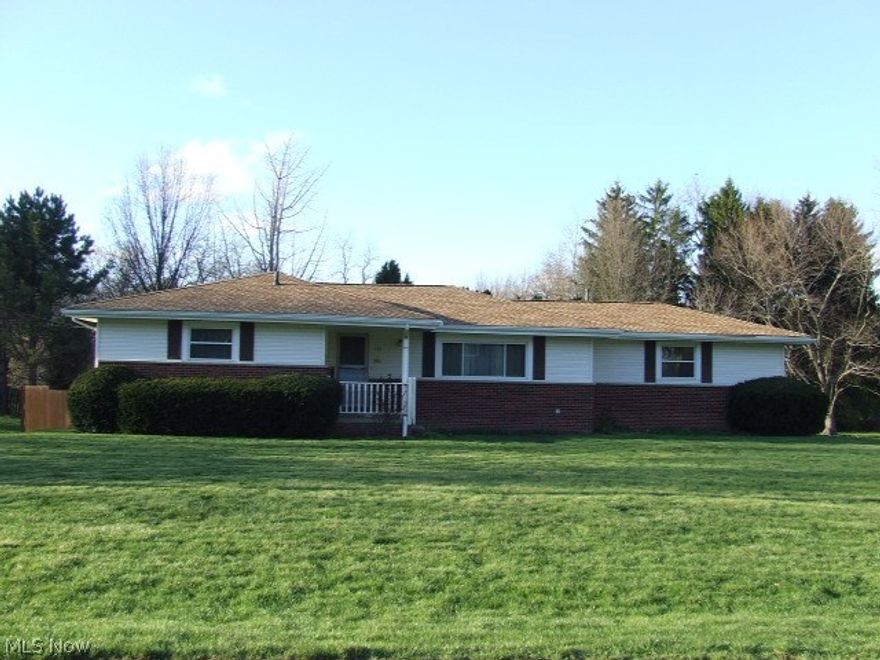 Rare HUGE Ranch in Tallmadge with many perks!  Master bedroom with bath, 2 other bedrooms, large, updated, applianced, eat-in kitchen with breakfast bar and dining area, gigantic dining room, large living room, and sun room leading to deck and private backyard.  Finished walk-out basement with half bath, workshop area and storage room with shelving.  Whole house fan. 3-car attached garage with hot and cold water.  Corner lot on a dead-end street.  Shed and extra parking spot.  Lots of updates including roof, windows, furnace, H20.  Home Warrranty.  Must see to believe - unusual for this area!