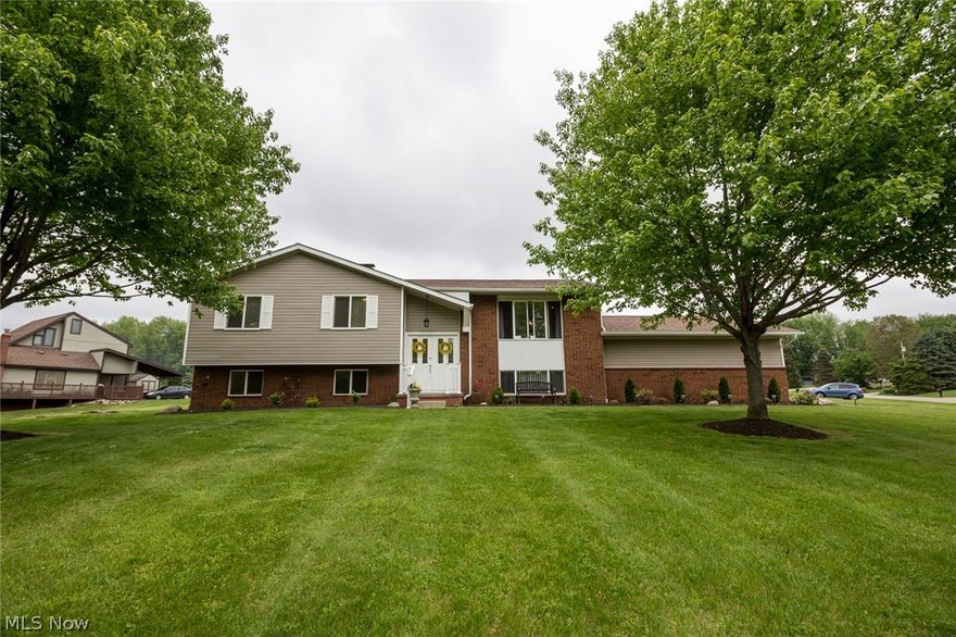 On almost an acre of well-landscaped green space you will find this lovely 3, potentially 5 bedroom home.  Sunshine pours through the large picture window highlighting the open living room which flows into the updated eat-in kitchen with ceramic tile floor, ample cream cabinetry and for the chef - two ovens!  Just down the hall you will find the owner's suite with one standard and one double closet and a full bathroom.  Bedroom 2 and 3 also have double-closets and all have newer, neutral carpet.  On the lower level the rooms can be utilized as it suits you.  There is a family room, a large office and a bonus room - all of which could be considered for guest or additional bedroom space.  There are two fireplaces, updated lighting, crown molding, added attic insulation, 200-amp electrical service, a 2-car attached garage (w/electric and water) and Zoned Heating.  So many valuable updates have been done for you - Roof (2016), Windows (2012), 95% Efficient Furnace and A/C (2007), Garage Do