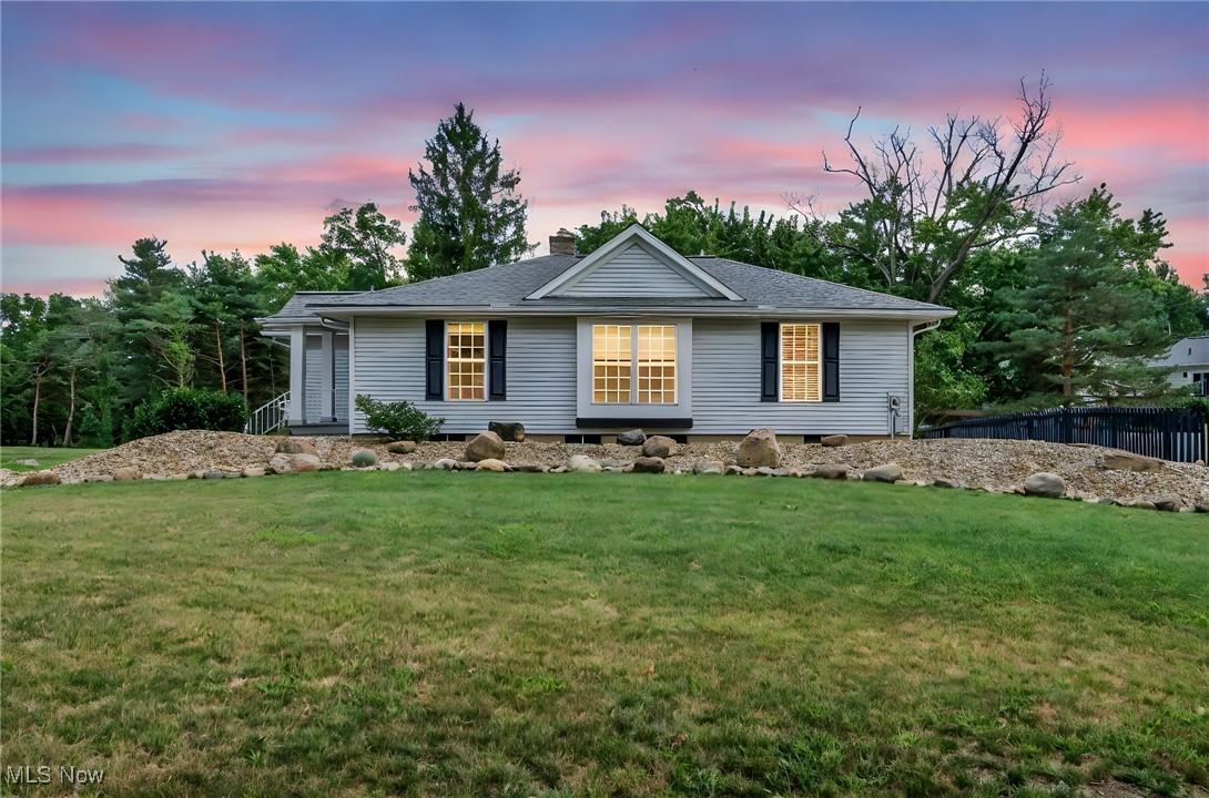 Rare opportunity to own a 1.7 acre lot just around the corner from the highly desired Medina Square! This two bed and two and a half bathroom ranch home has an open layout, beautiful hardwood floors throughout and is seton the street's LARGEST lot of land. The kitchen features a newer skylight window, Corian countertops, stainless steel appliances, and a Wolf gas cooktop with a hood. The great room features a wood burning fireplace and plenty of natural lighting. Don't forget about the extensive wrap around wooden deck, perfect for morning coffee or enjoying a summer night with friends and family. Another plus is the full walk-out basement with the potential to make another living space and bedroom. Roof 2020, Furnace, A/C 2011, H2O tank 2021. New window blinds, nest thermometer, French drain, and updated first floor plumbing. Schedule your showing today!