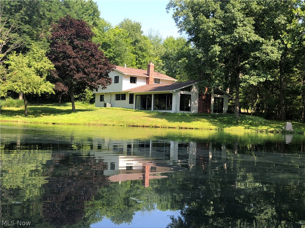 Remarkably well maintained and updated property. Your private oasis, yet convenient to everything. Just minutes from Chagrin Falls. This three (3) bedroom, two and one half bath house on 5 acres has wonderful views and a well stocked pond and a nearby fire pit. The move in ready home has been completely updated and restored. With walls having been moved or removed, the floor plan is open. Everything has been tastefully selected including Restoration Hardware paint. These improvement mostly in the past 3 years include a new roof, Brazilian redwood flooring throughout, ceramic tile in the kitchen and baths, new lighting fixtures, ceiling fans and recessed lighting in the completely renovated kitchen with custom Amish made cabinetry, Thermador professional grade appliances and honed granite counters. The gas utility service added a new furnace and central air so you have highly efficient heating and cooking. Culligan water treatment. Updated laundry mud room area provides extra stora