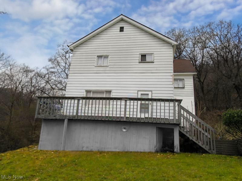 Nice 2 bedroom home on a hill with a scenic viewing deck ..Inside has plenty of updating done. Great for monthly rental income or resale for big profit. Owner selling at a loss.