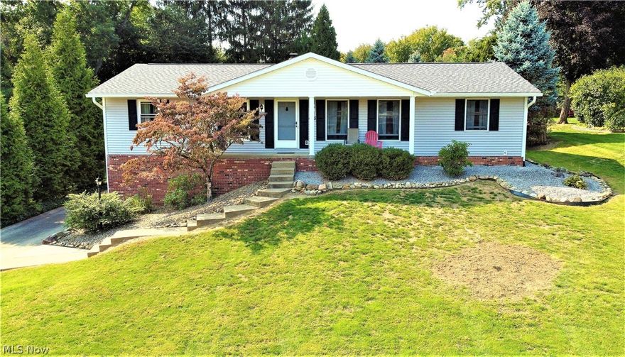MUST SEE RANCH HOME WITH A PARK LIKE LOT IN NORTH CANTON - This must-see home has an updated Kitchen with premium wood cabinets, drawer glides and storage galore, solid surface quartz counter tops and updated Appliances that stay. The Kitchen has great wood floors and a bar seating area for meals. The charming Family Room features a brick Fireplace with wood mantel and a walk-out to a large covered porch. The open Living Room features updated windows and new premium carpeting. Dining Room has plenty of room with new ceiling fan and new flooring. Home has (3) large bedrooms with big closets. Master Bedroom has new flooring, new closet doors and there is an updated must-see Full Master Bathroom. Basement has a finished Rec-Room with wainscoting and trim work. There is a Full Bathroom in Lower Level with vanity, toilet and oversized jetted garden tub. Home has (3) Full Bathrooms - wow! There is a large (2) Car Garage with lots of built-in storage and opener. Home has a covered Front Porch