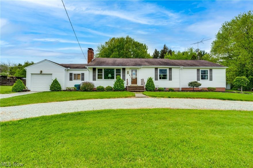 COMING SOON! Spacious, well-kept ranch home in Marlington School District. Rare find with 4 bedrooms sitting on almost 1 acre of land! Full basement with lots of possibility to finish for extra living space! Beautiful sliding glass doors leading to covered deck to enjoy warm summer nights and cozy fireplace indoors for chilly nights. Solid oak cabinets and chair rail to match! This home also provides convenient first floor laundry hook-up and a breezeway leading from garage complete with extra storage room. Two oversized bedrooms with double closets to provide plenty of room and storage! Don't miss your opportunity to own this ranch home with acreage just over a mile from the High school! Set up your private showing today!