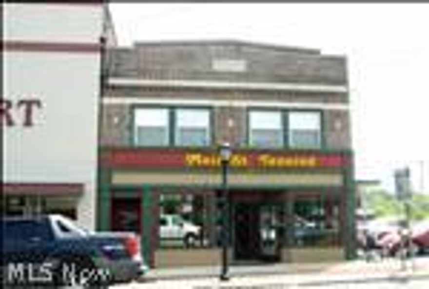 Two commercial buildings in downtown Hubbard on corner lot being sold together.  10 E Liberty St., Hubbard is zoned for retail trade. This one story building built in 1961 has approx. 1296 sq ft. with concrete block construction and slab foundation with an on-sight paved parking lot. The lot size is approx. 94x130 & real estate tax per year is $1751.88.  15 N. Main St. is a 2-Story brick building zoned as stores & residential built in 1929.  This has approx 5101 sq ft and the lot size is approx 30x98 & real estate tax per year is $1662.72.  The first floor is currently being used as a Suntan Spa.  The 2nd floor has one apartment and the other area is being used by the business next door as show room/storage. This building was also granted all the right, title & interest to the back alley adjacent to this building.