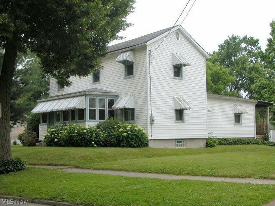 Affordable 4 Bedroom Home w/2 Baths, Large Dining Room & Kitchen w/breakfast Bar. 1st Floor Master, 3 Bedrooms up. Enclosed 8 x 16 Front Porch. 8 x 12 Covered Deck, many perennials & ornamental trees, Detached 2 Car Garage & off street parking. Nice Yard, Vinyl siding. Updated Electric, newer windows, furnace plumbed and ready for Central Air. Add a little decorating touches & you'll have a great place at a real great price.  Buyer to receive 1 Yr. Home Warranty. Perfect location to attend all the happenings and events in downtown.