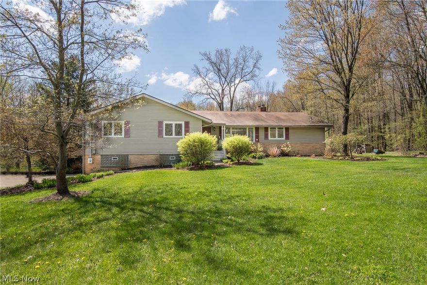 Hemlock Hills ranch style home with a knockout kitchen and updated bathrooms situated within steps of the neighborhood pool and recreation area!  Enjoy the wooded lot with pond, lawn space and privacy.  Enter the threshold into this open concept floor plan with impressive hardwood floors and incredible views of the backyard. Current owners have gutted and renovated the kitchen with cherry cabinetry with pullout drawers, custom wine cabinet, stainless appliances and quartz countertops!  Fireplace can be used on both the family room side and dining room side which has additional living space as well.  Master suite boasts a spacious bedroom, plenty of closet space and bathroom with newer vanity and brand new tiled shower with custom bifold glass door.  Find 3 additional bedrooms and updated second bath with double sinks and quartz counters. Abundance of storage can be found in the unfinished basement area downstairs as well as a 3-car garage!  Minutes from restaurants and shops in downtow