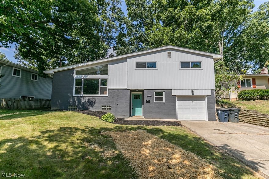 Welcome to this beautiful move-in ready split level in West Akron! The living room boasts a large picture window to allow the natural light to shine in, also do not miss that charming ceiling! The updated kitchen looks out to the living room and has attractive flooring throughout. The open concept of the kitchen and living room would make the perfect space for entertaining! The kitchen has stunning granite counter tops that accents the subway tile and white cupboards. Four nicely sized bedrooms with new flooring and carpets and two updated bathrooms. Downstairs has an additional room to use as an office or rec room but it also has a door to access the patio. As well as the patio there is a large deck overlooking your yard. This turnkey home won't last long, take a look at it today!
