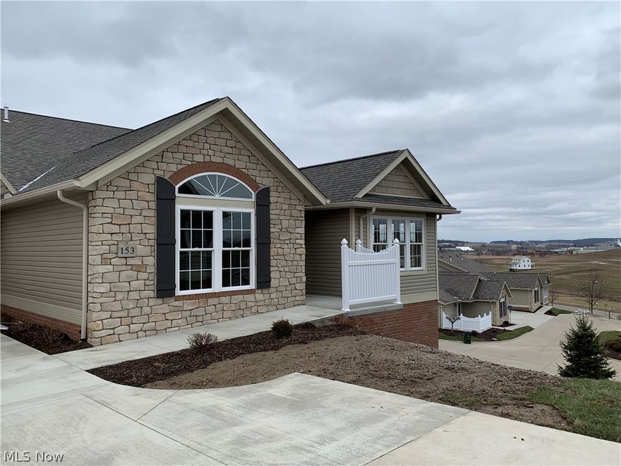 153 Heritage Crossings is apart of duplex, so you get windows in the garage and only 1 neighbor! 2 bedrooms and 2 full baths. Excellend views and basement has large windows to take advantage of the hill side setting.
