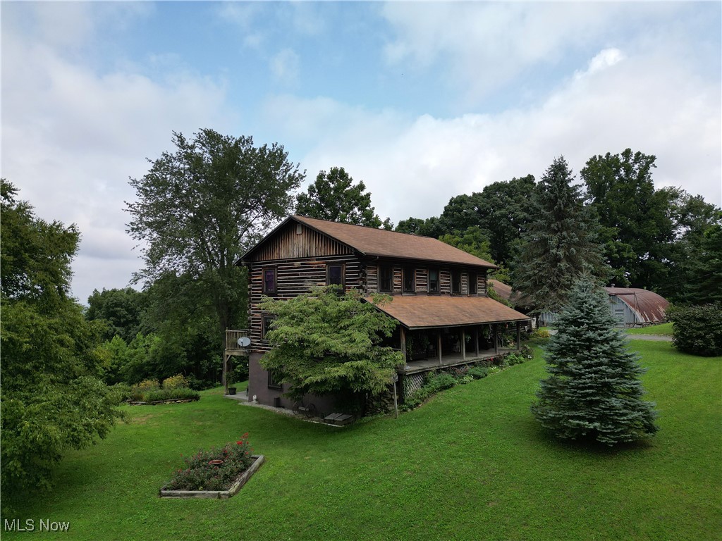 1091 River Rd., Rainelle, WV 25962~ Extraordinary Log Home in a prime location nestled on 27.6 +/- acres in the majestic mountains of Fayette County, West Virginia with stunning panoramic views that change with the seasons. This extraordinary 3,658 sq. ft. hemlock log home offers everything. Located just 15 minutes from Babcock State Park and a mere 27 minutes from the breathtaking New River Gorge National Park, this property is the perfect opportunity for a bed-and-breakfast, multifamily living situation, or a high-income Airbnb venture. This location is an adventure seekers dream with activities such as the annual New River Gorge Bridge Day event with base jumping, endless white water rafting, zip lining, hiking, horse back riding, boating, and ATV trail riding, all right there. Not to mention the land is abundant with large and small game for the avid hunter, fruit and nut trees, with ATV trails and a hunting stand waiting ready to go. There is also additional hunting club land nearby. Also close by is Hawks Nest State Park, Ace Adventures, Summersville Lake, and the town of Fayetteville.
This home was built to last by one of the same engineers who contributed to the iconic New River Gorge Bridge. It features extra steel supports, foam and chemical treatments, with the inner walls being fortified with tongue-and-groove treated plywood and 2x6 studs set 12 inches on center. Designed for comfort, it offers two kitchens, and separate distinct living areas. With a two-car attached garage. This home has a greenhouse, 52 x 33 quonset hut, city and well water, a generator and multiple heating sources, including wood heating stoves and a gas furnace, ensuring comfort year-round regardless of the weather. Don't miss out on this chance to own a piece of West Virginia's mountain heaven. Contact the listing agent today to schedule a private viewing and explore this remarkable property! **Must have proof of funds or lender pre-approval.