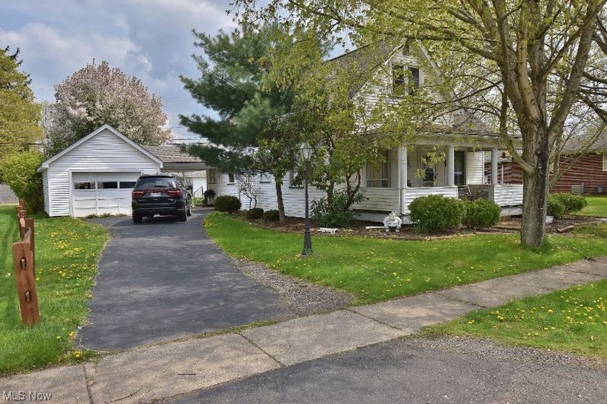 Really cute 2-3 bedroom home on a great lot in the quaint village of Dellroy and just a short walk to the shores of beautiful 1540 acre Atwood Lake. A one car garage is attached to the house via a breezeway/ patio area making a great place for outdoor entertaining. The flat back yard provides an area for family fun, pets and children to play. Large covered front porch is ideal for that first morning cup of coffee or to enjoy the sunset with your favorite beverage. The main floor is all set for one floor living offering a large laundry, kitchen open to a large dining room, living room, bathroom & 1 bedroom. The upper floor provides a large 12x18 bedroom & another room that could serve as a 3rd bedroom, office or hobby room. A full unfinished basement provides plenty of space for storage. All appliances including the washer & dryer will remain with the home excluding the microwave. Paved driveway. Newer windows and roof but cannot verify the age.