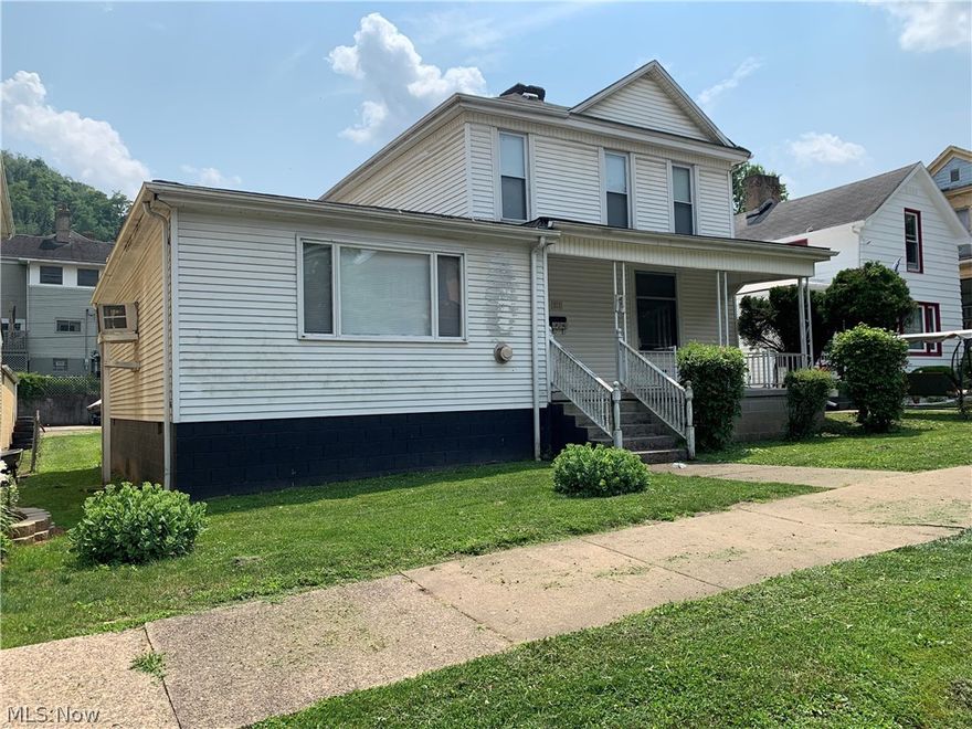 211 Bennett Street, 2434 Sq ft, 4 bedrooms, 2 baths, 2 decorative fireplaces. Master bedroom (32 x 16) on the main floor. Off street parking in rear. Nice level lot and easy access to Rt 7 and I-70.