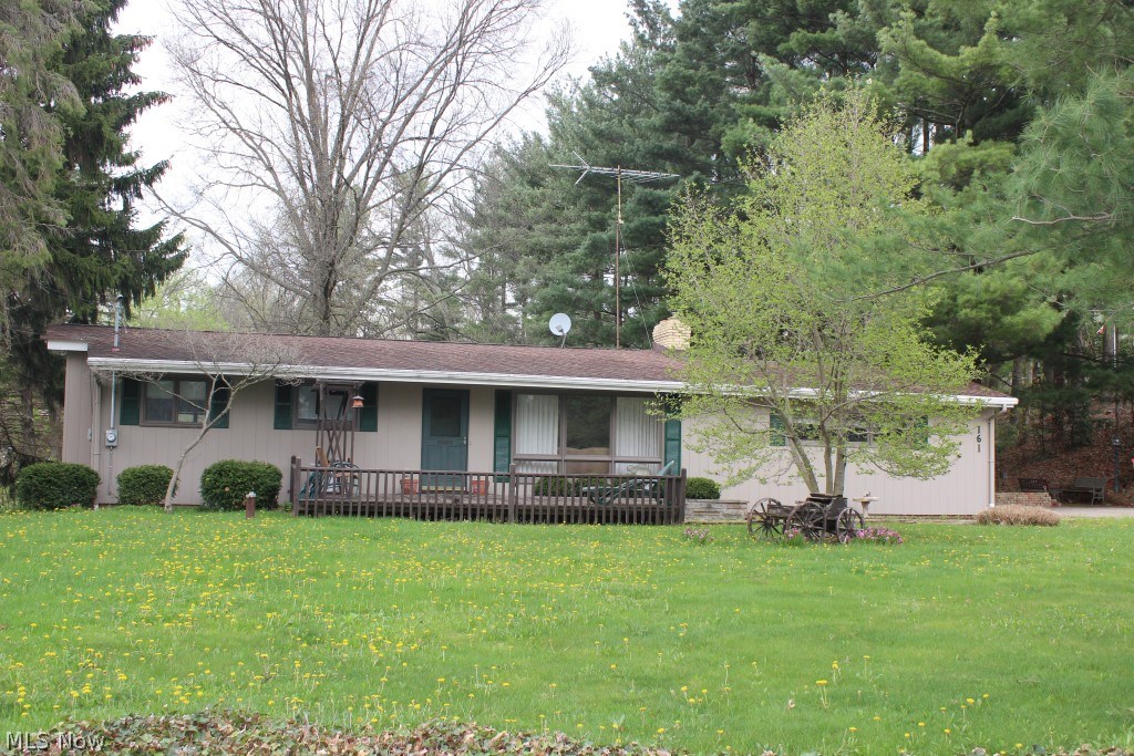 One owner beautifully maintained 3 bedroom/2 bath ranch on .57 acres in Portage County-Springfield Schools* Having 1348SF including finished basement, freshly painted inside, 3 season sun room with 2 sky lights & 3 sliding glass doors over looking private back yard* Light & bright living room* Dining room with wood floors* Applianced oak kitchen (refrig, range & dishwasher), wood floor & 2 sky lights* 3 bedrooms with wood floors under carpet (2 with ceiling fans)* Recreation room & full bath in basement* 2 storage sheds* Central air, shingles & electrical box with 150 amp service approx. 7-8 years* Water pump & pressure tank- 2014* New faucets* Glass block basement windows* Douglas fir floor joist & 1" thick redwood siding* Gutter guard* Well insulated* Tranquil setting* Neutral decor* Just move in!