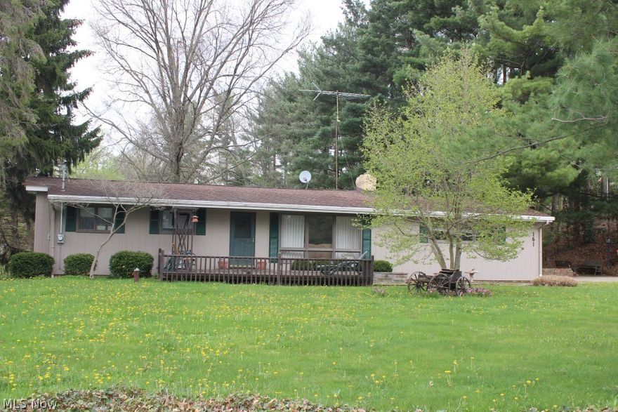 One owner beautifully maintained 3 bedroom/2 bath ranch on .57 acres in Portage County-Springfield Schools* Having 1348SF including finished basement, freshly painted inside, 3 season sun room with 2 sky lights & 3 sliding glass doors over looking private back yard* Light & bright living room* Dining room with wood floors* Applianced oak kitchen (refrig, range & dishwasher), wood floor & 2 sky lights* 3 bedrooms with wood floors under carpet (2 with ceiling fans)* Recreation room & full bath in basement* 2 storage sheds* Central air, shingles & electrical box with 150 amp service approx. 7-8 years* Water pump & pressure tank- 2014* New faucets* Glass block basement windows* Douglas fir floor joist & 1" thick redwood siding* Gutter guard* Well insulated* Tranquil setting* Neutral decor* Just move in!