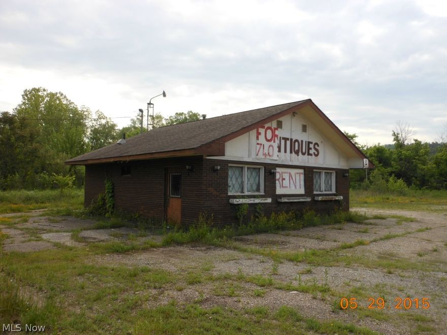 I-77 Exit 16 immediately off Interstate. Level lot with plenty of parking. Natural gas, AEP electric, public water and sewage shared with adj. gas station sewer plant. MWCD is $12/yr. Great location just off Interstate exit and access to I-77.