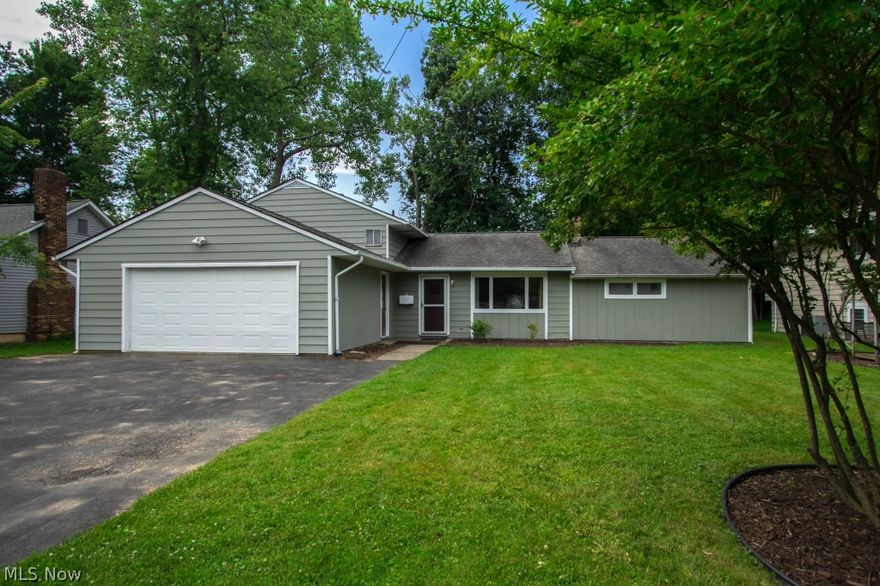 Over-improved, open floor plan, 4 bedroom, 2-1/2 bath split level in quiet residential neighborhood is move-in ready! Large living room with wood burning fireplace offers plenty of natural sunlight and is open to dining room bayed window. The entrance to the kitchen is highlighted by a domed ceiling with track lighting. Updated eat-in kitchen with all appliances (new range) has large pantry, lunch counter with bar top seating and sliders to outdoor patio. The kitchen is also open to family room with second wood burning fireplace and is a great place for entertaining. First floor master suite has walk-in closet, built-ins and full bath with his and her sinks with granite countertops, tile floor and separate walk-in shower. Three additional nice-sized bedrooms and full bath complete the upper level. The lower level features a large recreation room, half bath and utility room with plenty of storage. Two-car attached heated garage with electric and water.  Home has been renovated by a mast