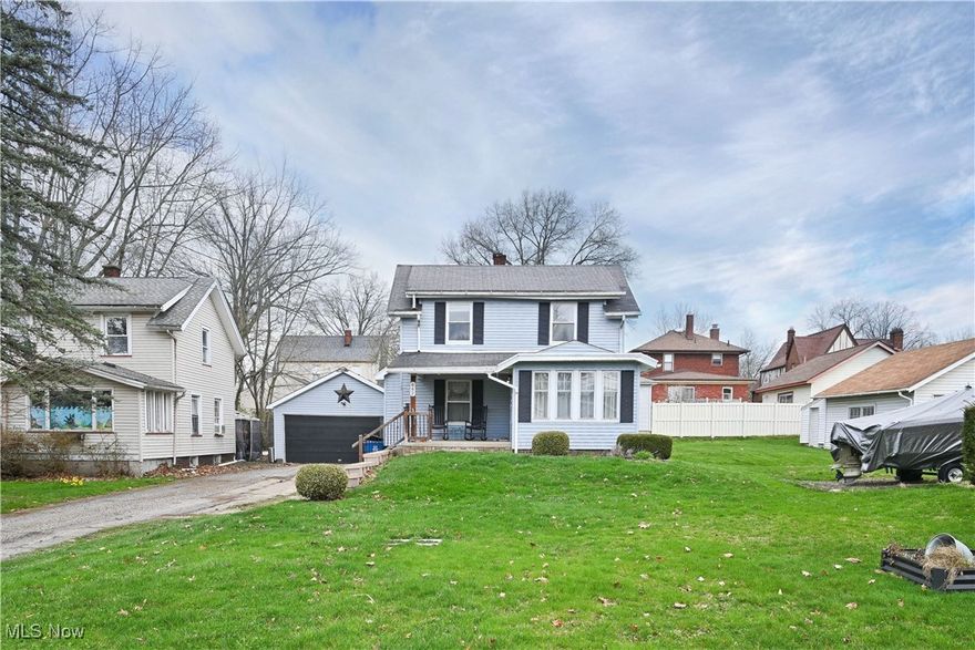 What a great find! This two story offers many great features including an attached two car garage! Nice covered front porch to enjoy your large front yard. The cheerful parlor opens to the spacious living room and large dining room with built in curio cabinet. All are hardwood floored and there is an abundance of nature lighting making the space very welcoming. The kitchen was remodeled in 2015, and has nice cabinets and modern countertops. Appliances all stay! There is a cute coffee bar area off the kitchen in the first floor mudroom with extra cabinets as well for great additional storage and first floor bath tucked away off this room as well! Upstairs are three spacious bedrooms, all carpeted and ample closet space plus a full bath that was given a modern facelift. Nice linen space in the hallway with built in drawers as well! Full basement. 100 Amp panel. Central Air, Furnace is a 95% high efficiency, water tank replaced in 2/2025. Washer (2 yrs old) and dryer to stay! Schedule your appt today!