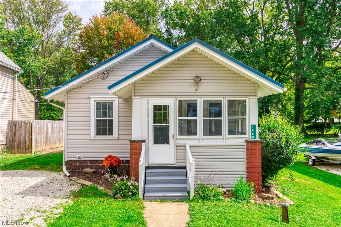 Just Move In! You will love this updated 2 Bedroom, 1 Bathroom Ranch Featuring an enclosed front porch, Open Living Room/Dining Room with fireplace. Charming updated Kitchen includes all appliances. You will love the Barn Doors that open to the Bedrooms. Huge Deck overlooks private backyard. Great place to relax or entertain. Newer windows, Metal Roof. Make your appointment to see today.