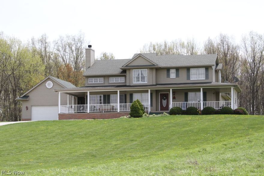 What a place to call home! A private lane leads to this beautiful custom built home on 13 acres. Lot consists of open fields, woods and a pond.  Free gas & royalties!  A peaceful private location yet close highway access.  Minutes to Canton, Hartville, Alliance. 4 bedrooms, 2.5 baths w/open spacious floor plan. 2 story great room & kitchen w/maple cabinetry. Dinette opens onto the rear deck. Wonderful 1st floor master suite, lie in bed & gaze at the stars through the skylight. Another first floor bedroom or office located on the main floor.  Second floor features 2 large bedrooms w/Jack & Jill bath. Lower level w/workshop/ built in tool bench.  A 28x30 barn provides space for 2 more cars, loft and more. Plus a pond for fishing! Updates include new gas water heater, new water well in 2012, dishwasher, built in microwave and roof.   Kick back and relax on the expansive wrap around porch and  enjoy the peaceful surroundings.  Call today for a showing.