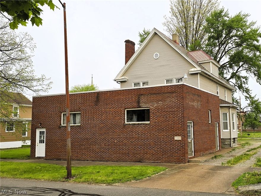 229 5th St, Elyria, OH 44035 — Mixed-Use Opportunity Awaits. Discover the untapped potential of this versatile mixed-use property located in the heart of Downtown Elyria. Zoned for mixed use, this unique offering features a former chiropractic office on the first floor and a comfortable two-bedroom, one-bathroom apartment on the second floor — ideal for the savvy investor or owner-occupant who dreams of living upstairs while running a business below.**Renovation Potential That Inspires.** The expansive first-floor office space is primed for conversion into one or multiple residential apartments, and the large attic space offers even more opportunity — the current owner has architectural drawings already prepared for completing an additional apartment upstairs. Whether you envision a thriving multi-unit rental property or a creative live-work arrangement, the possibilities here are truly exciting.**Parking That Delivers.** A generous gravel parking lot accessible from Barres Street, combined with a private driveway off 5th Street, provides multiple ingress and egress points — a rare advantage for both residential tenants and commercial visitors alike. Efficiency is built in, with separate HVAC and hot water systems