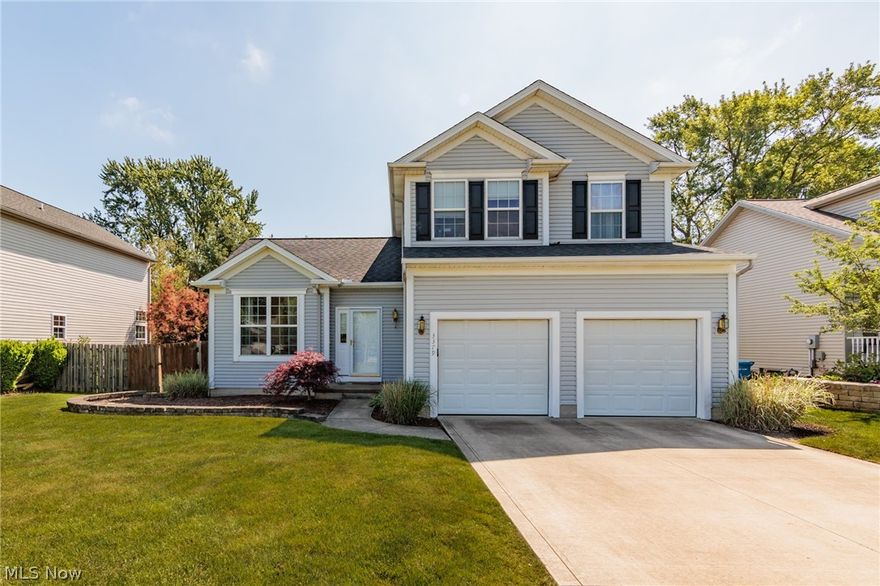 This well maintained colonial in North Olmsted offers a convenient location and a spacious layout perfect for family living and entertaining. The vaulted ceilings and multiple living areas provide plenty of room for relaxation and socializing. The family room with a gas fireplace is a cozy spot for gathering, while the eat-in kitchen with newer appliances and access to the paver patio is great for hosting summer parties. The fenced-in yard with privacy pines offers a peaceful outdoor space, and the first floor features a powder room and laundry room for added convenience. The large primary suite with vaulted ceiling, walk-in closet, and updated en suite bathroom is a luxurious retreat, while the two additional bedrooms share an updated full bath. The unfinished basement provides plenty of potential for customization, whether you're looking to create a game room, home theater, or additional living space. With newly installed windows, central air, and hot water tank, this home is move-in ready and offers peace of mind for years to come. Conveniently located near shopping, parks, I480 and the airport! Don't miss out on this fantastic opportunity to make this house your new home!