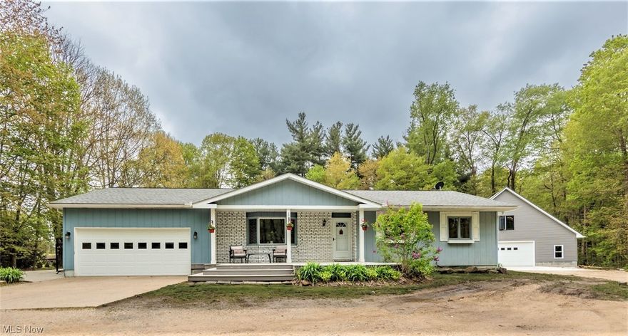 MODERN UPDATED RANCH sitting on 1.75 Acres and Attached 2+ Car Garage. Nestled in the woods the house sets deep and back away from the country road with a private setting. This open floor plan has so much to offer! Newer LVP Wood Floors throughout and Freshly Painted Interior. Unexpected surprise with a Large Addition. Relax on the side or front Deck while taking in the breathtaking surroundings. Large Living Rm w/Bay Window. The Updated White Kitchen features Stainless Steel Appliances, Pantry, and Island Breakfast Bar. Plenty of Cabinets and Counter Space make it a Cooks Dream Kitchen. Take a Look at the 23x23 Vaulted Family Rm w/floor to ceiling Brick Fireplace, Skylights, Bay Window, and Woodburning Stove. Great Heat Source. The 1st fl Laundry & Powder Rm are easily accessible. Master Suite features Vaulted Glamour Bath w/Jetted Tub, Separate Shower, and Sitting area or Dressing Room. The other 2 bedrooms are just steps from the updated main bath.  The Lower Level gives Additional Living Space w/Recreation Rm and a woodburning stove. Full divided basement has several rooms for a workshop, storage, and hobby rm or home office. 2nd Laundry room too. Summer Fun w/above ground Pool, Hot Tub, Patio for BBQs and Entertaining. Out Building Barn (2018) w/side patio will accommodate 2-4 cars and storage on the second-floor loft. Roof-2016, Furnace-2020, Air Conditioner-2020, Windows-2013/2023. Move-In Ready. Great House to Call Home. View Today!