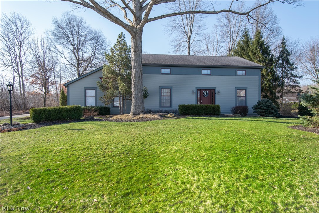 This 3 bedroom 2.5 bath has such great CHARACTER!! Walk into the Foyer area with new laminate tile like floors and a new BEAUTIFUL front door. The stairway splits the living room with carpet floors and dining room with hardwood floors and glass doors. (currently uses as office) The kitchen area is 34 x 14 that has AWESOME hardwood floors with newer countertops and sink, island, panty and appliances to stay. A step down family room with hardwood floors and fireplace. Update BEAUTIFUL 1/2 bath. The interior doors are redone old doors that adds a lot of charm to home. 2nd level has a great size master bedroom with walk-in closet and full bath with shower. The other 2 bedrooms are also great size with nice size closets, berber carpet, and ceiling fans. The 2nd level full bath has been completely updated and has double sink. The basement area has rec room with area with carpet floors. 2 car garage with pebble stone floor(warranty transferable) and newer garage door. Black top driveway. Shed