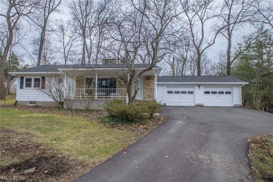 Tucked away in an established mature neighborhood & away from the hustle and bustle--yet close to Routes 43 (Kent, points south) and 480 (Streetsboro, points north)--this ranch home boasts wide front porch, 2 wood burning fireplaces, very spacious lower level knotty pine family room with fireplace and a beautiful wooded lot... among other things! Experience the natural surroundings close to hiking, sledding, cross country skiing and lake views at Twin Lakes, Lake Rockwell and Towner's Woods! You'll appreciate the beauty of original wormy chestnut in the Living Room and hardwoods in hall and bedrooms! And enjoy incredible number of UPDATES including: the newer windows throughout, total roof replacement, new furnace and central A/C all in 2014! Bath was remodeled and includes Bathfitter surround. Kitchen slider was added as egress to back yard in 2014. Kitchen updates include KitchenAid stove, wood laminate flooring, Bosch dishwasher, sink and countertops. As well, wood laminate flooring