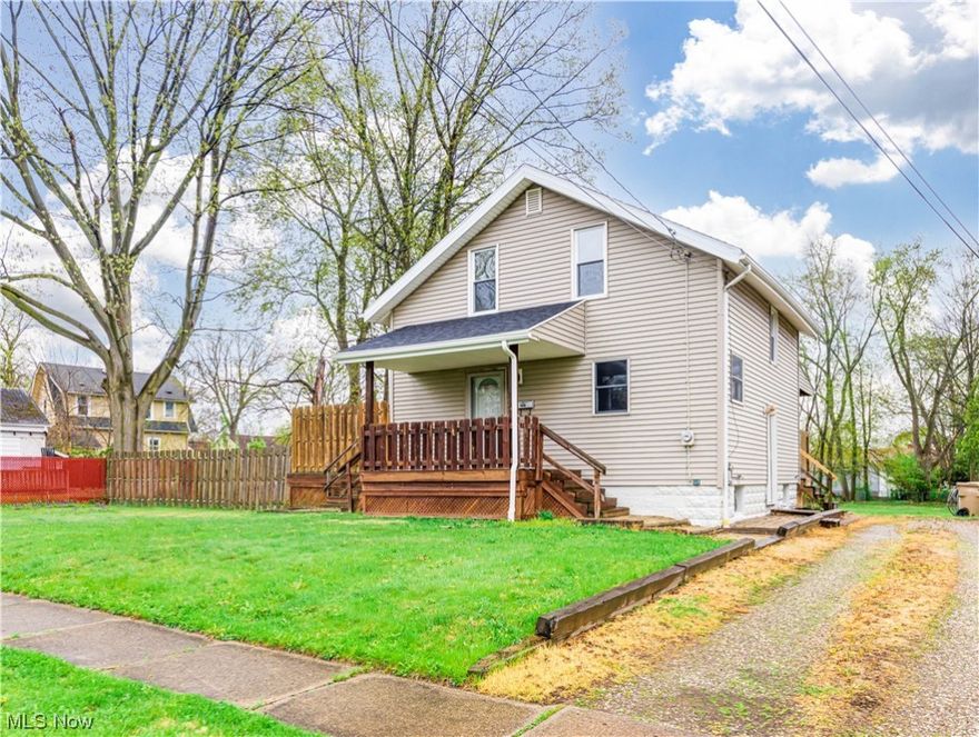 Do you want a great Cuyahoga Falls house close to downtown with good highway access AND a large (double) lot?  This is your find!  Open Kitchen/Dining area with ceramic tile and unique Hardwood flooring.  Dining area has sliders to a massive Private Deck!  New flooring through much of house.  Large BRs.  Bath with a jetted tub.  Mechanically, it's got a New Roof, Brand New Furnace & Central Air and Hot water tank! Vinyl Siding.  2nd bathroom is in basement.  Come take a look at this affordable Falls home today!