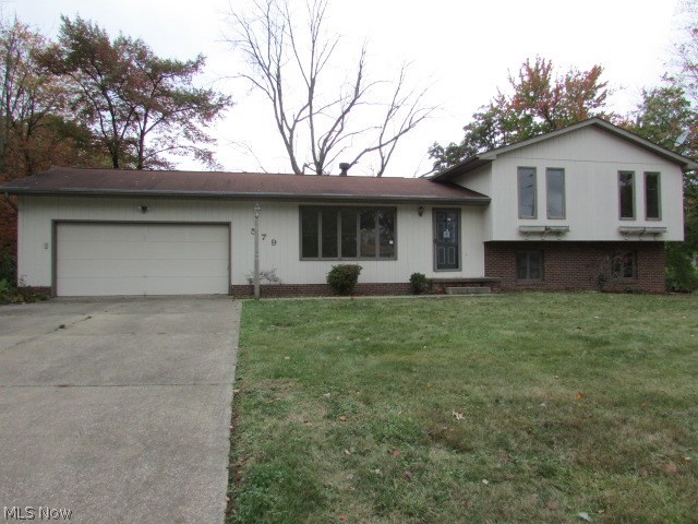 Great family home with a nice lot of mature trees. Split Level with 3 to 4 bedrooms and two full baths. Living room/dining room area opens up to a nice deck. Large lower level family room with fireplace. This home has lots of room and storage with an attached 2 car garage. Home has new carpet and fresh paint. Move in ready! Property sold AS IS.